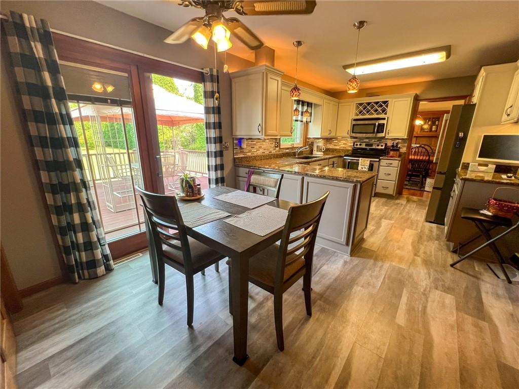 100 Marion Drive Butler, PA 16001 - Photo 10 of 45 a view of a dining room with furniture and wooden floor