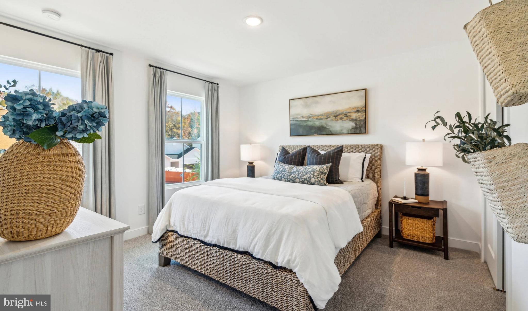 432 Lot Street Ranson, WV 25438 - Photo 20 of 22 a bedroom with a bed and a potted plant