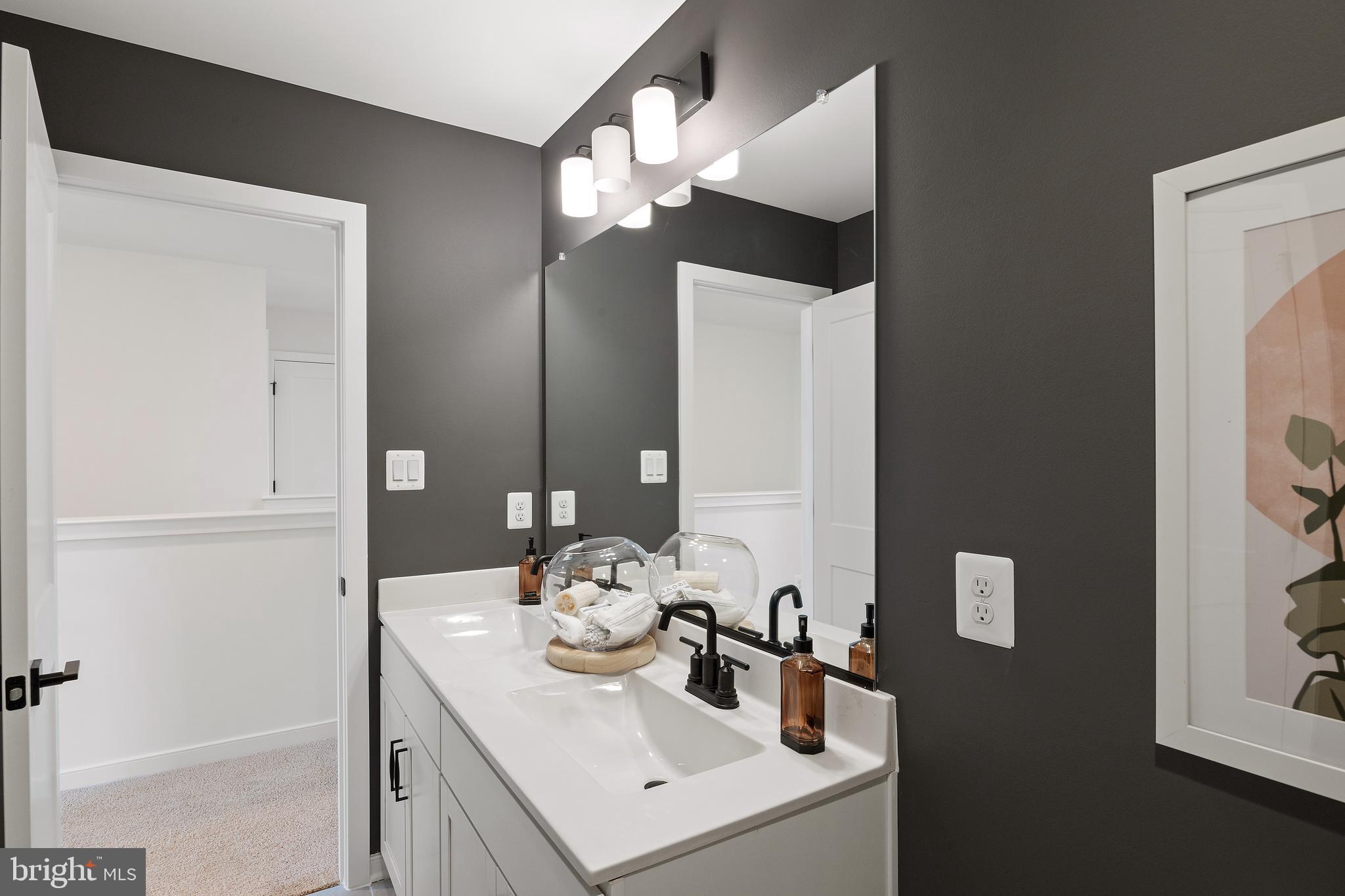 432 Lot Street Ranson, WV 25438 - Photo 21 of 22 a bathroom with a sink and a mirror
