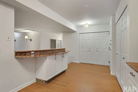 a bathroom with a shower sink and mirror