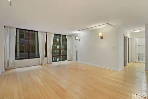 a view of an empty room with glass door
