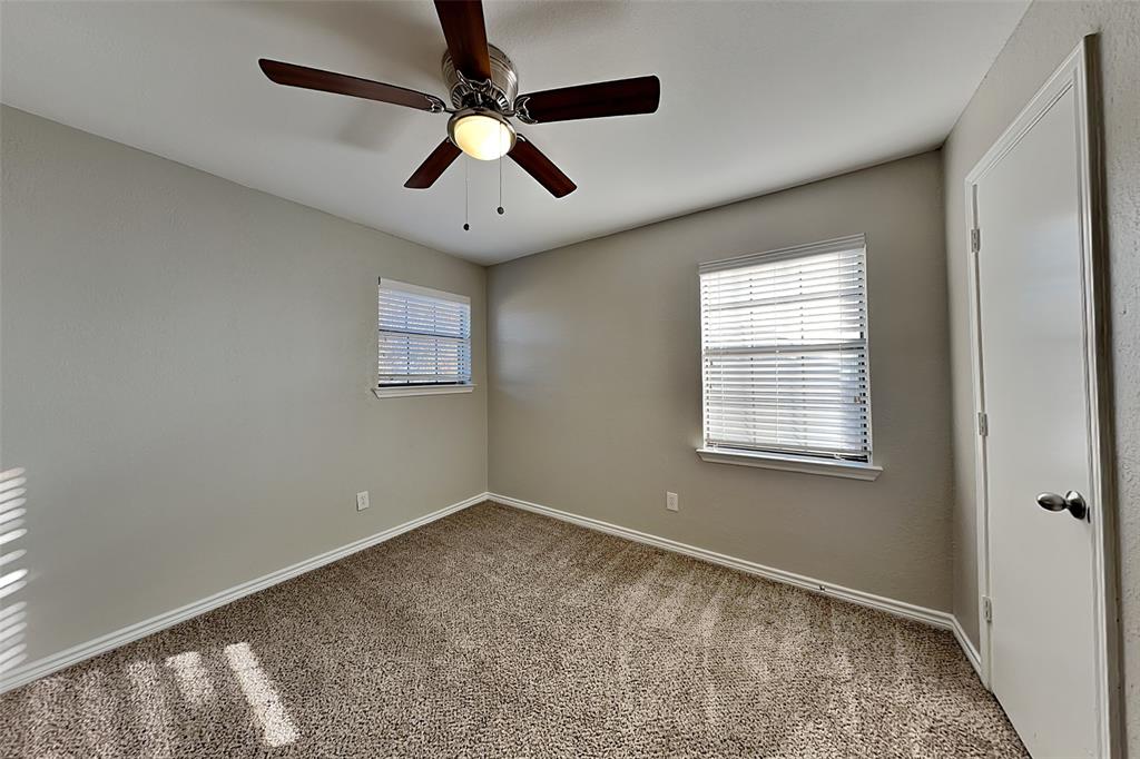 508 Rawhide Court Plano, TX 75023 - Photo 13 of 19 an empty room with a window and a fan