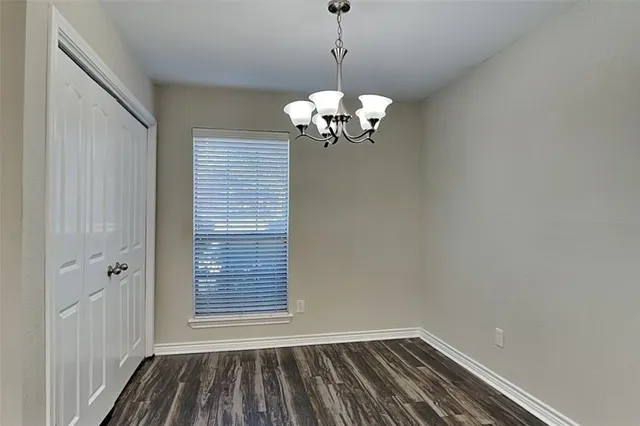 a view of a room with window wooden floor and a ceiling fan