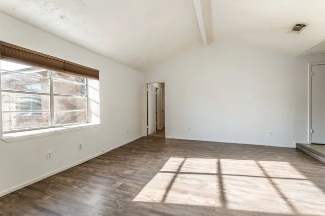 a view of an empty room and window