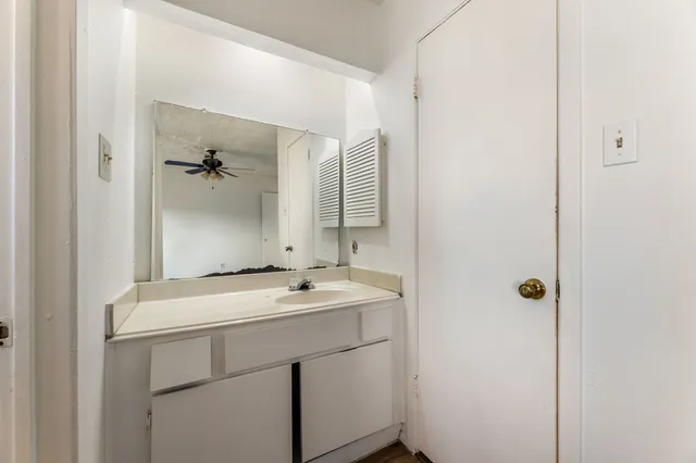 a bathroom with a sink and mirror
