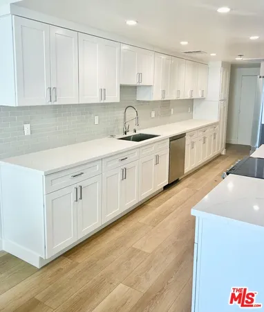 a large kitchen with cabinets