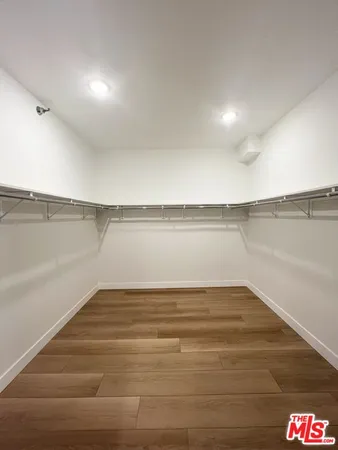 a view of an empty room and an entryway