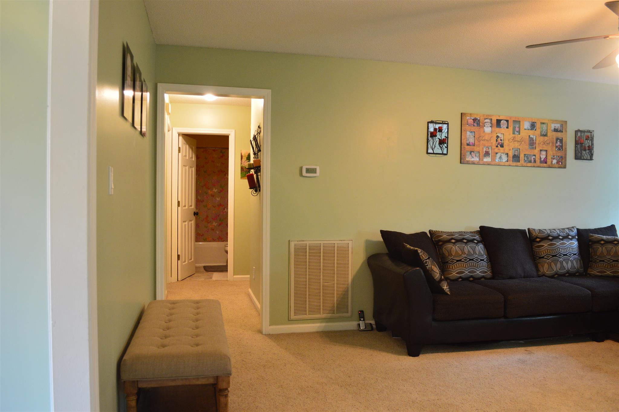 3361 Backridge Road Woodlawn, TN 37191 - Photo 17 of 30 a living room with furniture and a fireplace