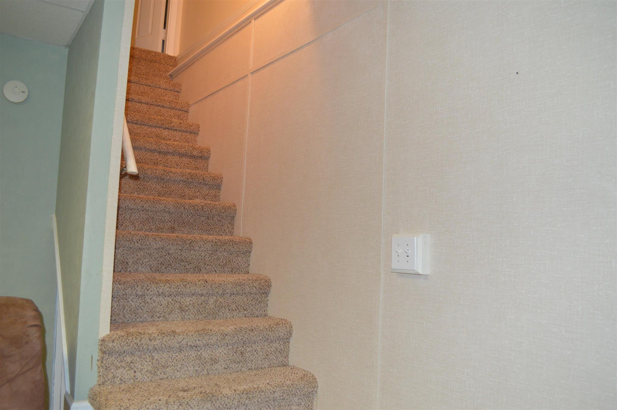 3361 Backridge Road Woodlawn, TN 37191 - Photo 21 of 30 a view of staircase with white walls