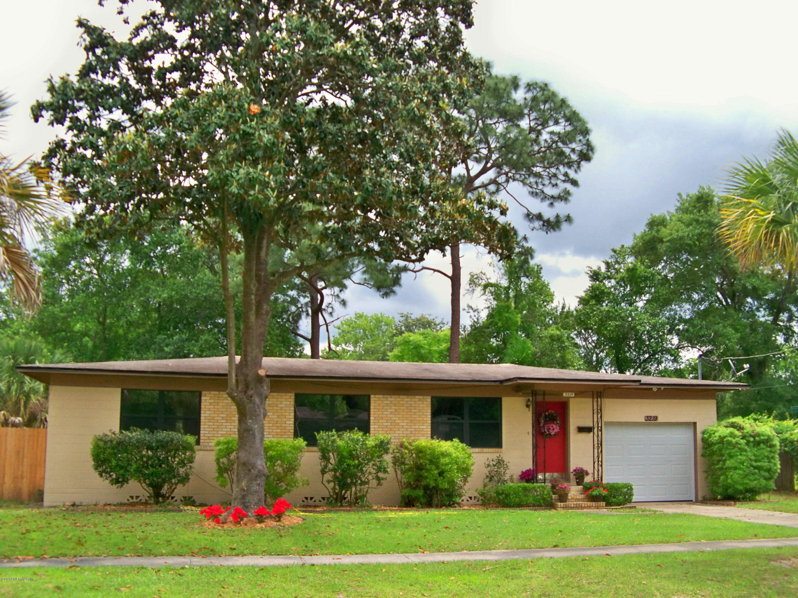 3219 Rogero Road Jacksonville, FL 32277 - Photo 1 of 13 a view front of house with yard and green space