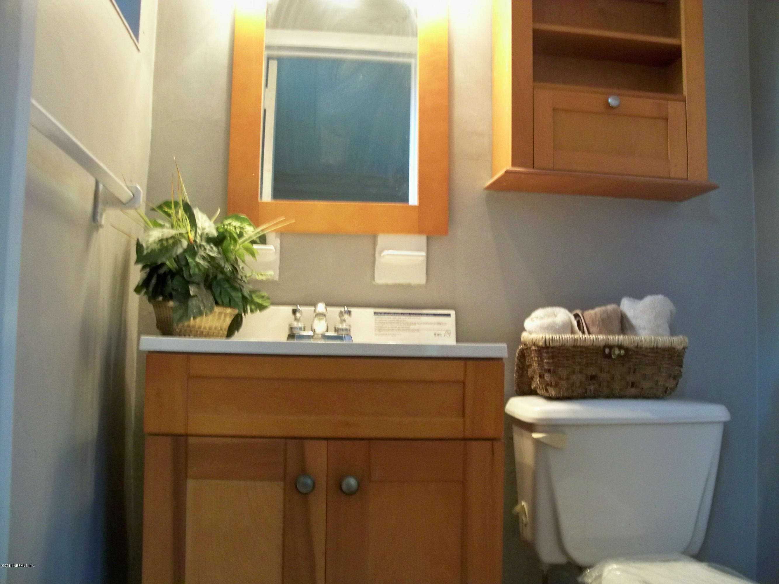 3219 Rogero Road Jacksonville, FL 32277 - Photo 10 of 13 a bathroom with a toilet and a sink