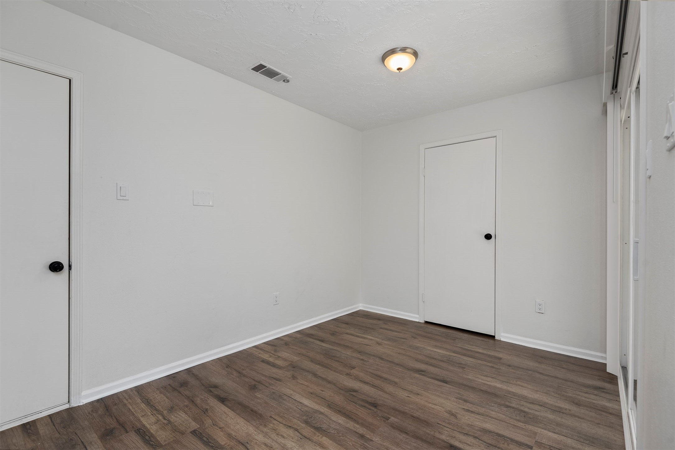 30 Berryfrost Lane The Woodlands, TX 77380 - Photo 11 of 33 a view of room with wooden floor