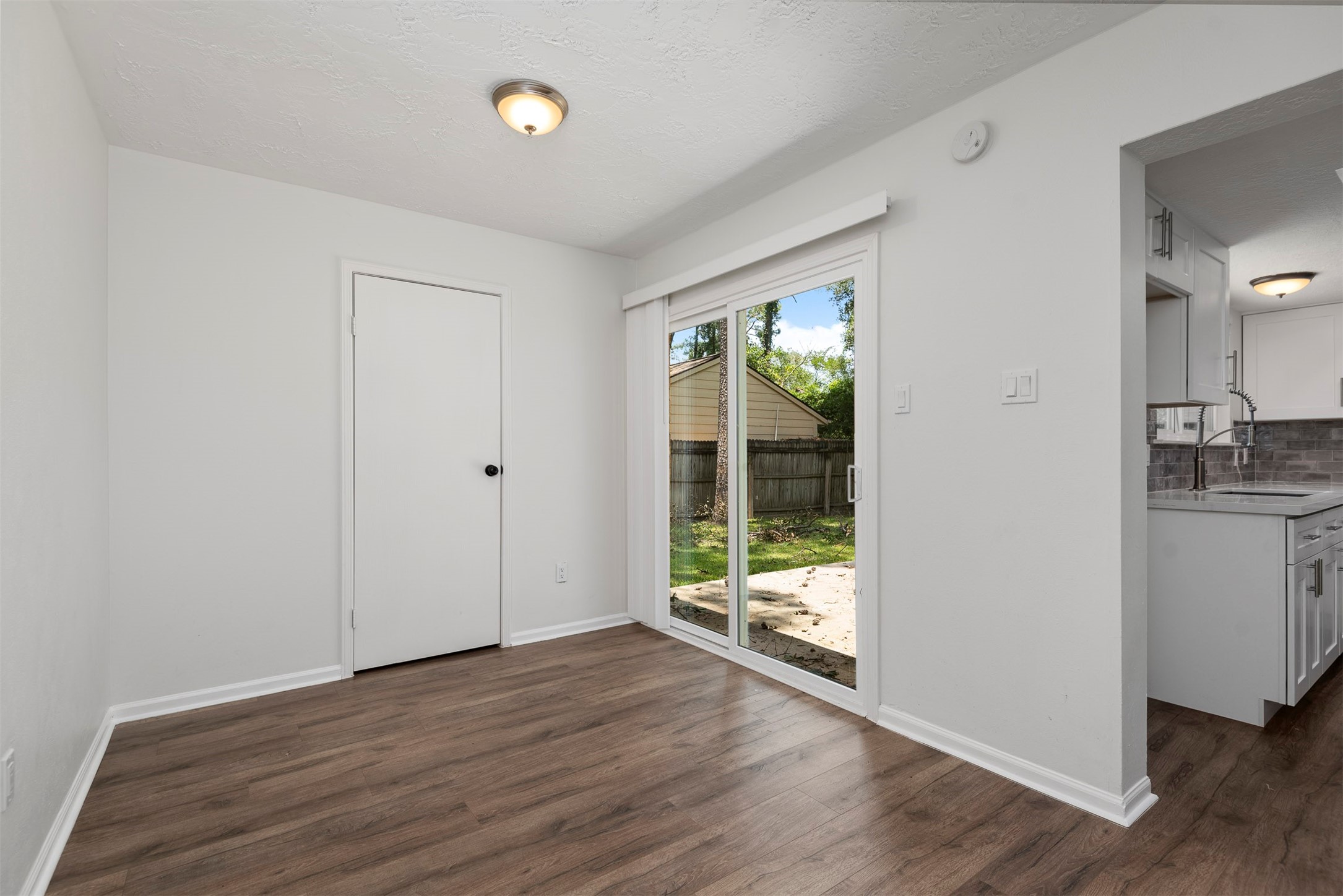 30 Berryfrost Lane The Woodlands, TX 77380 - Photo 12 of 33 a view of wooden floor and windows in a room