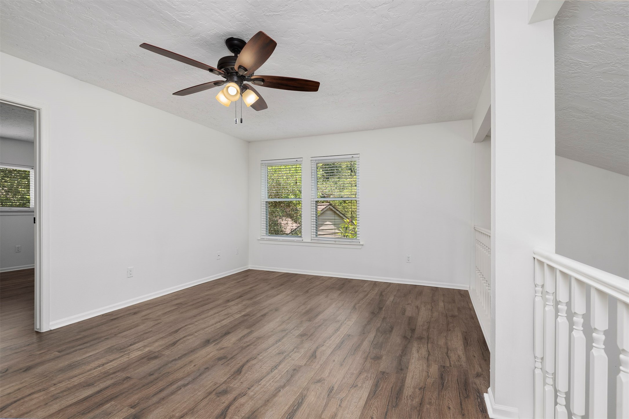 30 Berryfrost Lane The Woodlands, TX 77380 - Photo 22 of 33 wooden floor in an empty room with a window