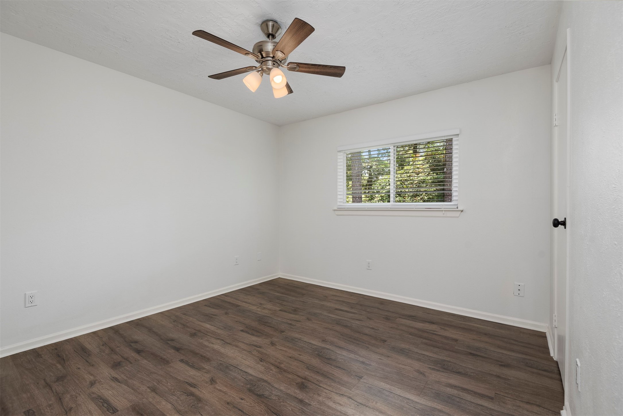 30 Berryfrost Lane The Woodlands, TX 77380 - Photo 26 of 33 wooden floor in an empty room with a window