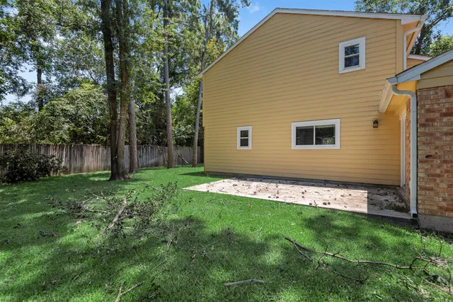a view of an house with backyard space and garden