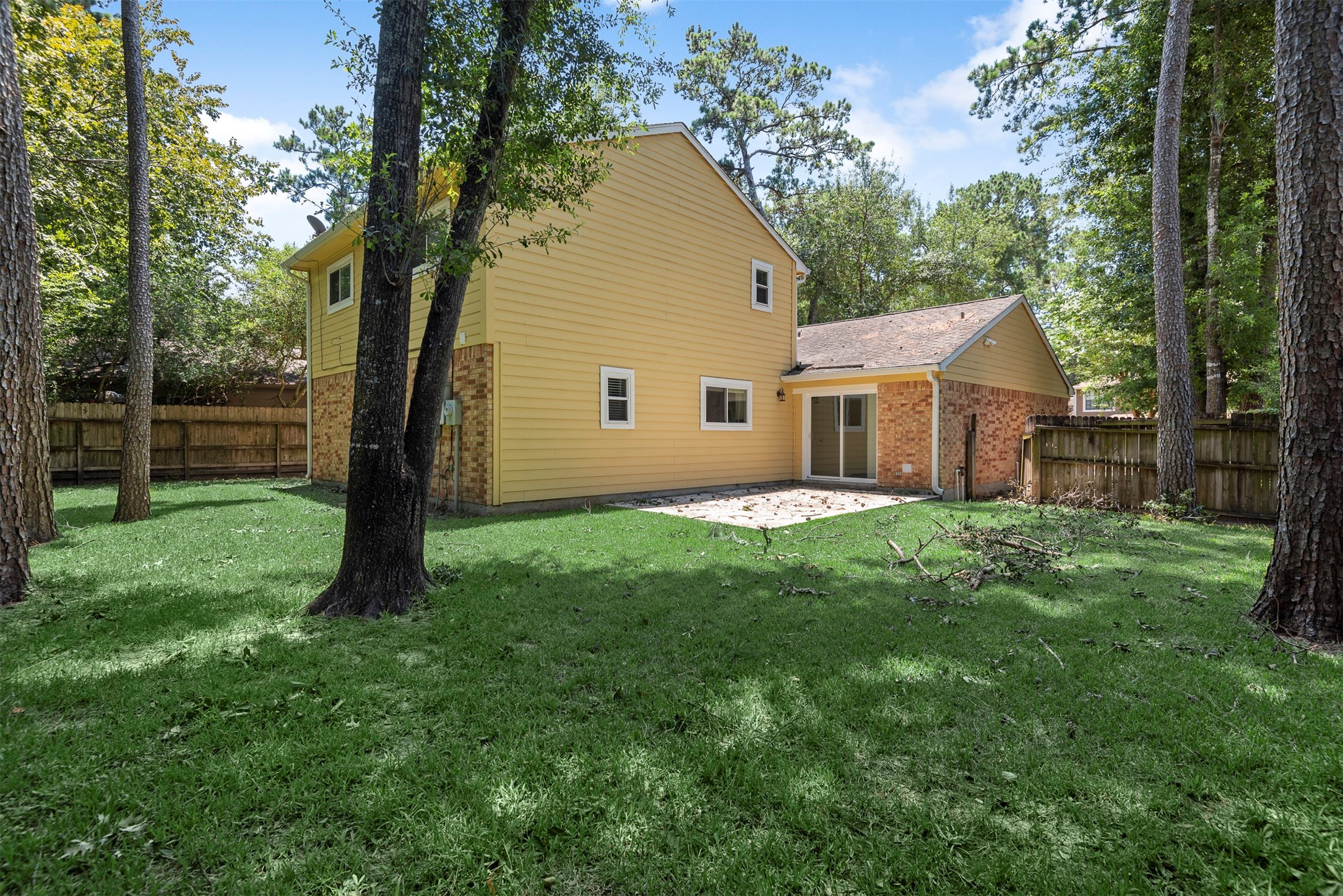30 Berryfrost Lane The Woodlands, TX 77380 - Photo 30 of 33 a view of a house with a backyard and a tree