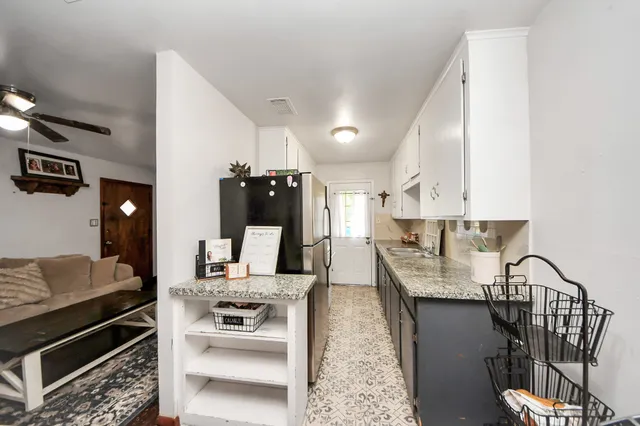 a kitchen with a stove and a refrigerator