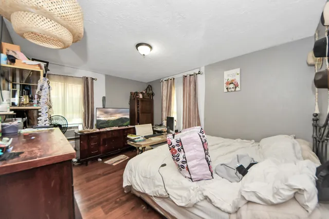a bathroom with a sink vanity mirror and toilet