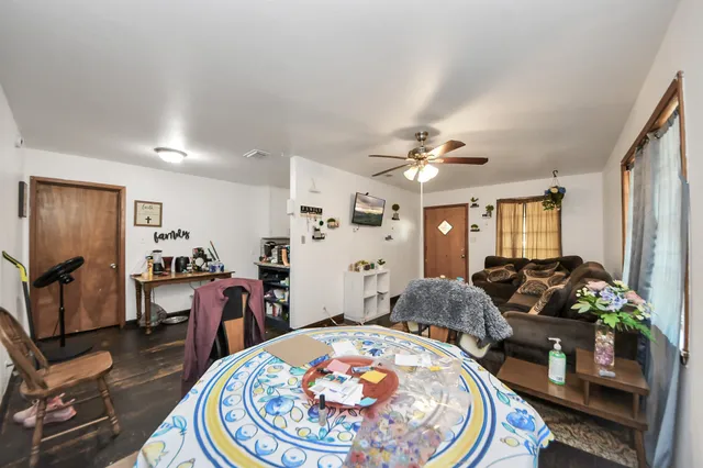 a kitchen with a refrigerator and a stove