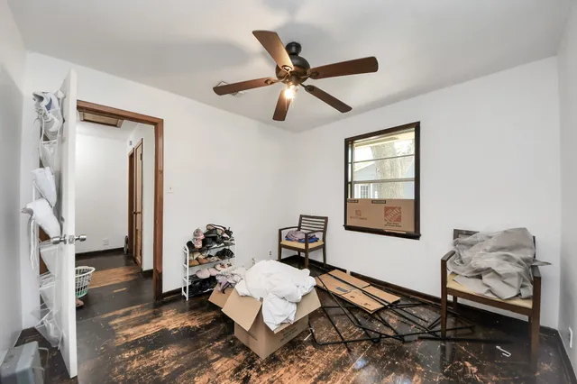 a bedroom with furniture and a chandelier