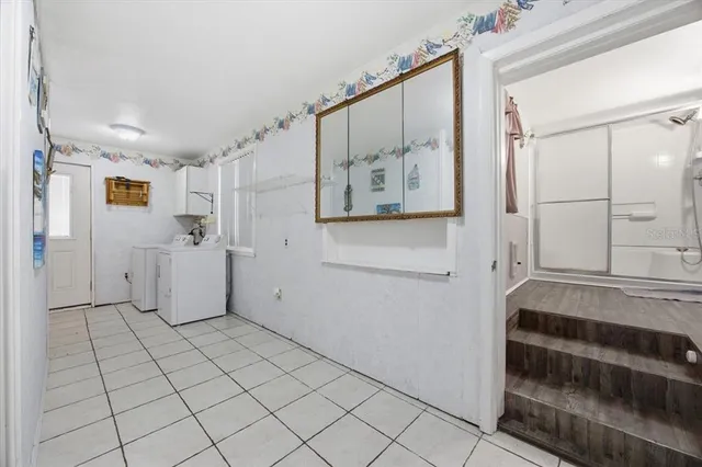 a bathroom with a bathtub and shower