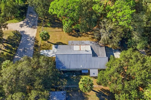 front view of a house with a tree