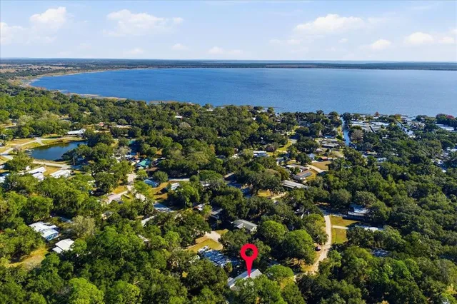 a view of a field with an ocean