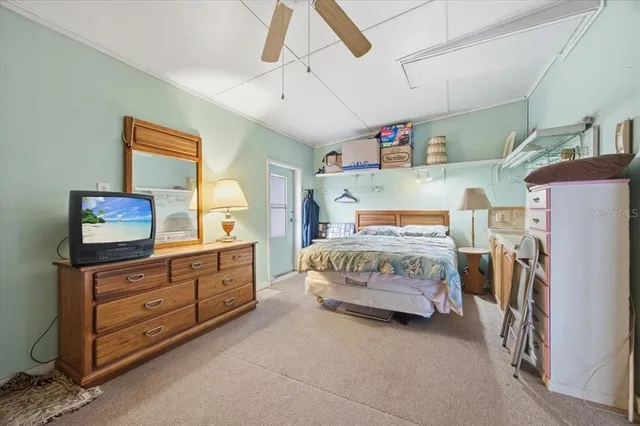 a bedroom with a bed and furniture