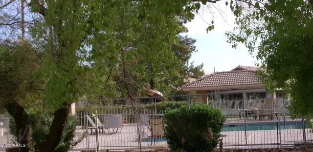 a front view of house with a garden