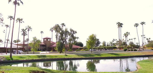 a view of swimming pool and trees in the background
