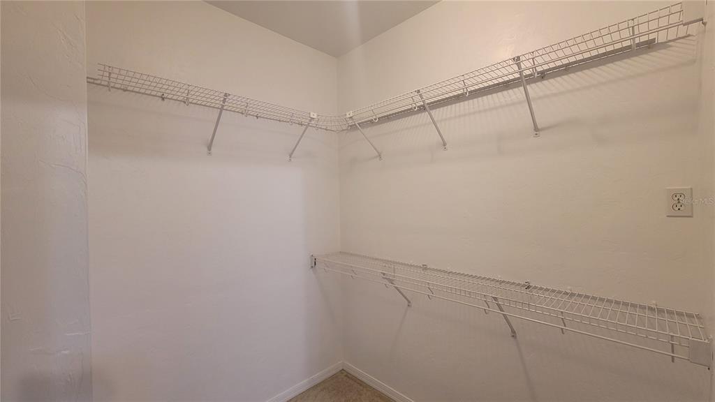 4926 Northwest 78 Road Gainesville, FL 32653 - Photo 11 of 18 a view of a room with racks on the wall