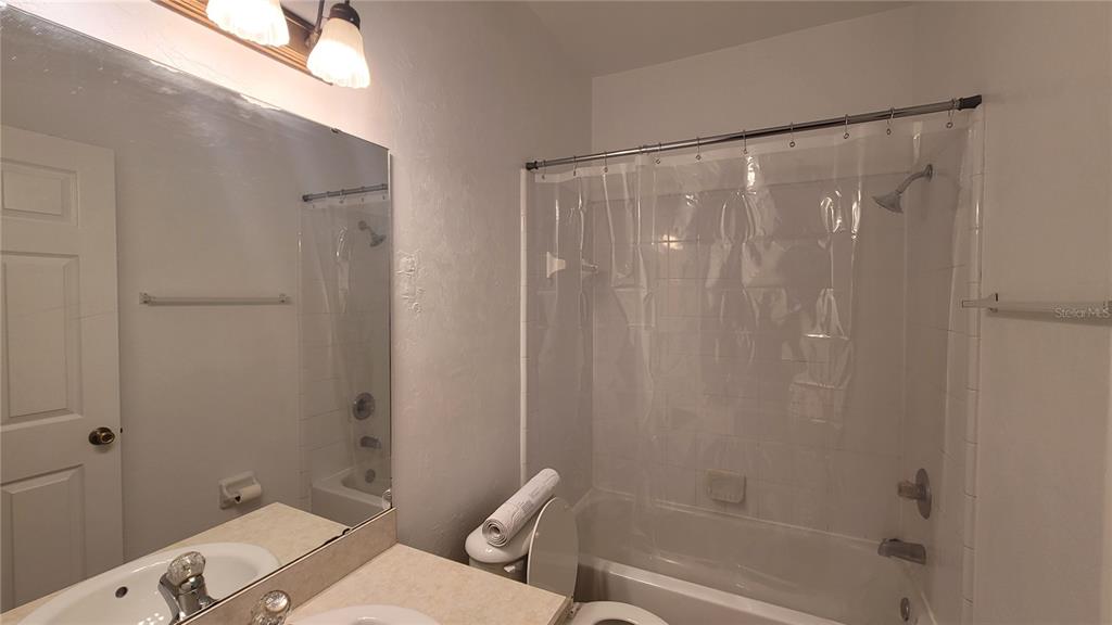 4926 Northwest 78 Road Gainesville, FL 32653 - Photo 12 of 18 a bathroom with a sink and a mirror