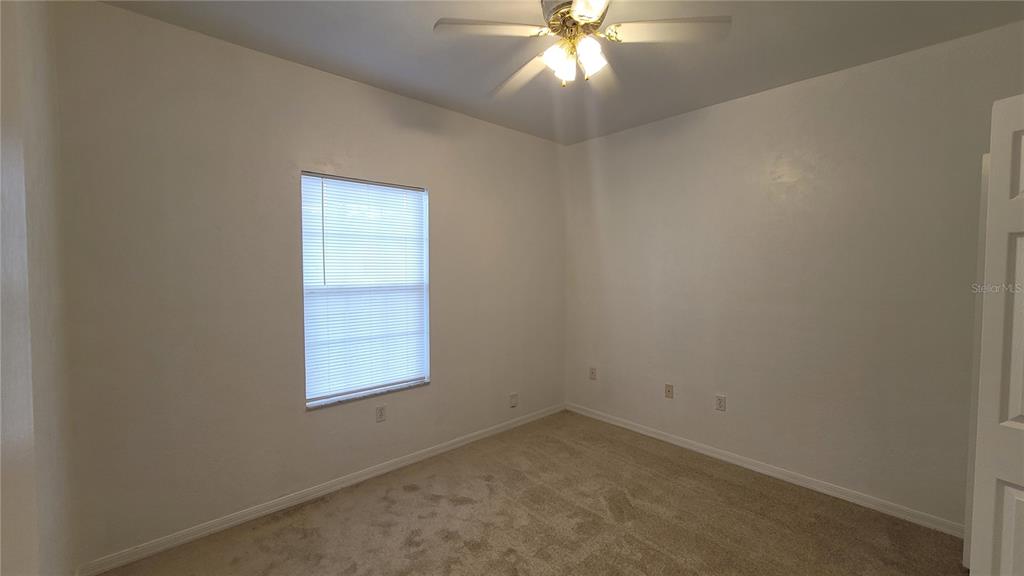 4926 Northwest 78 Road Gainesville, FL 32653 - Photo 14 of 18 an empty room with a window