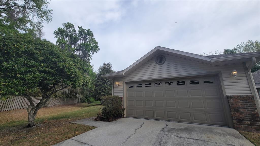 4926 Northwest 78 Road Gainesville, FL 32653 - Photo 17 of 18 a front view of a house with a garden