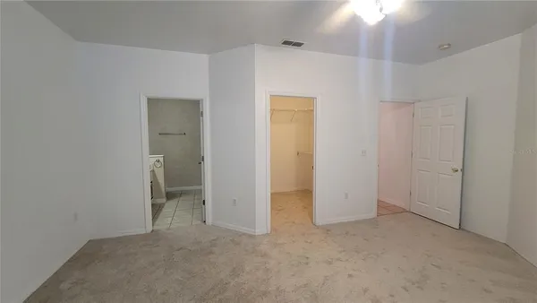 a bathroom with a sink toilet a mirror and shower