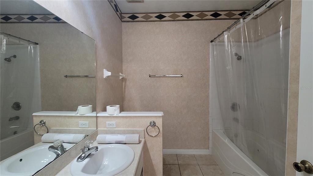 4926 Northwest 78 Road Gainesville, FL 32653 - Photo 10 of 18 a bathroom with a sink toilet a mirror and shower