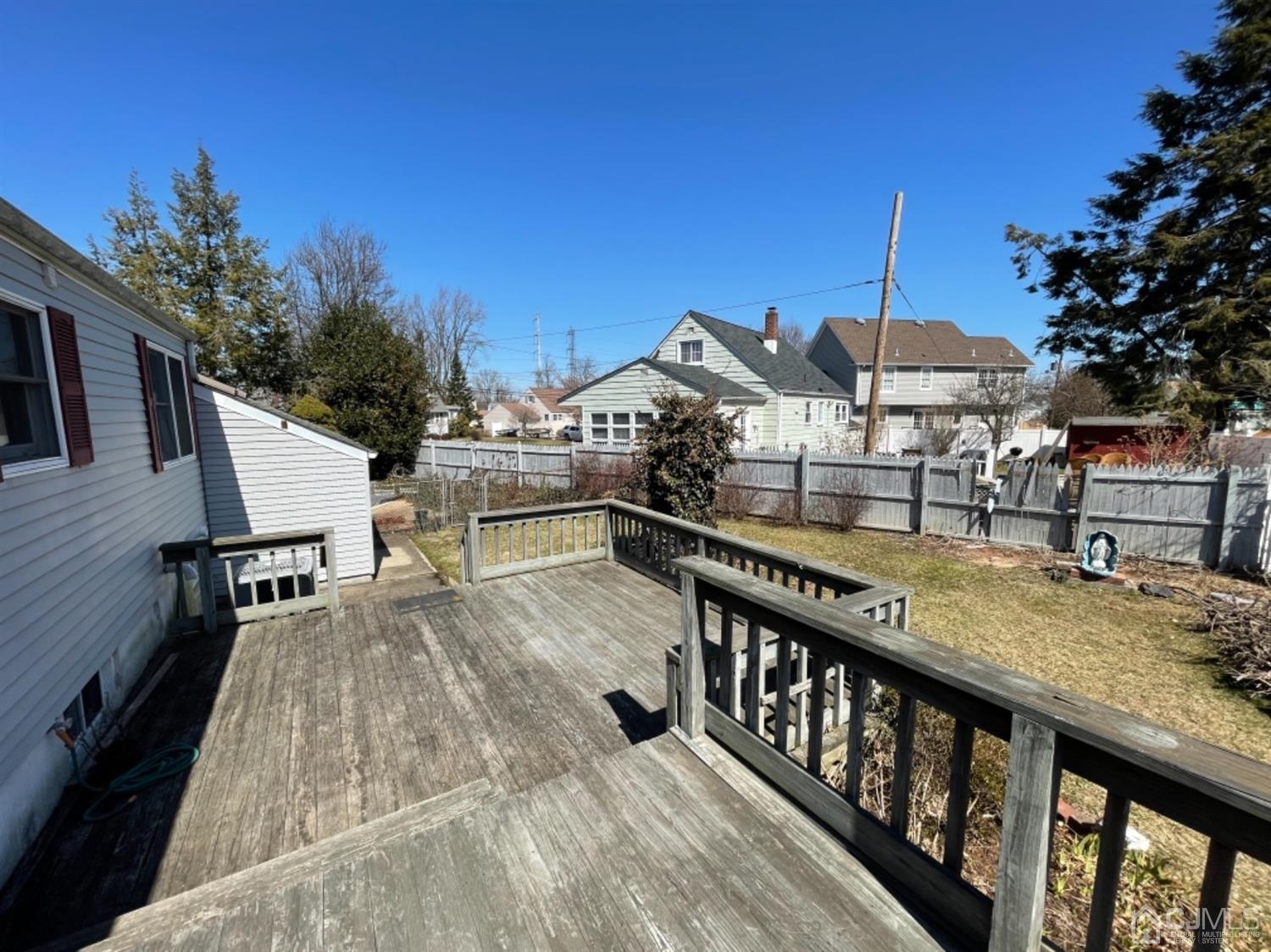 144 Tunison Road New Brunswick, NJ 08901 - Photo 8 of 14 a view of a balcony with wooden floor and outdoor seating