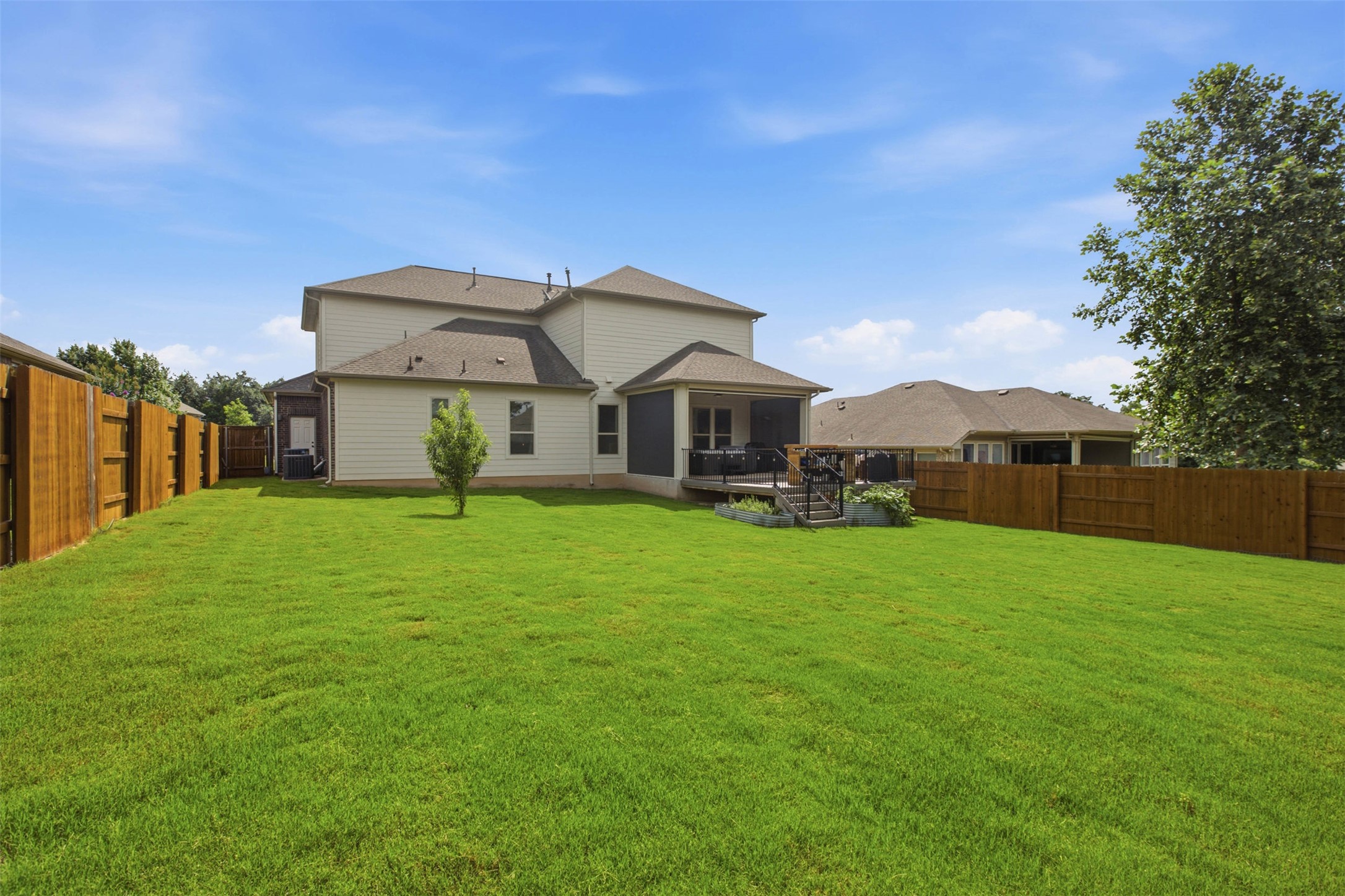 1113 Modoc Way Kyle, TX 78640 - Photo 31 of 34 A spacious, verdant yard with ample room for leisure, featuring a private fenced perimeter.