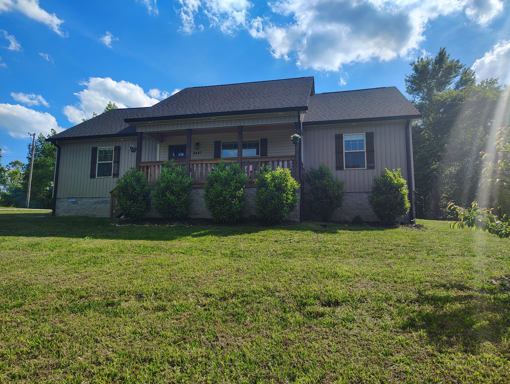 8447 Epperson Springs Road Westmoreland, TN 37186 - Photo 1 of 25 a front view of a house with garden