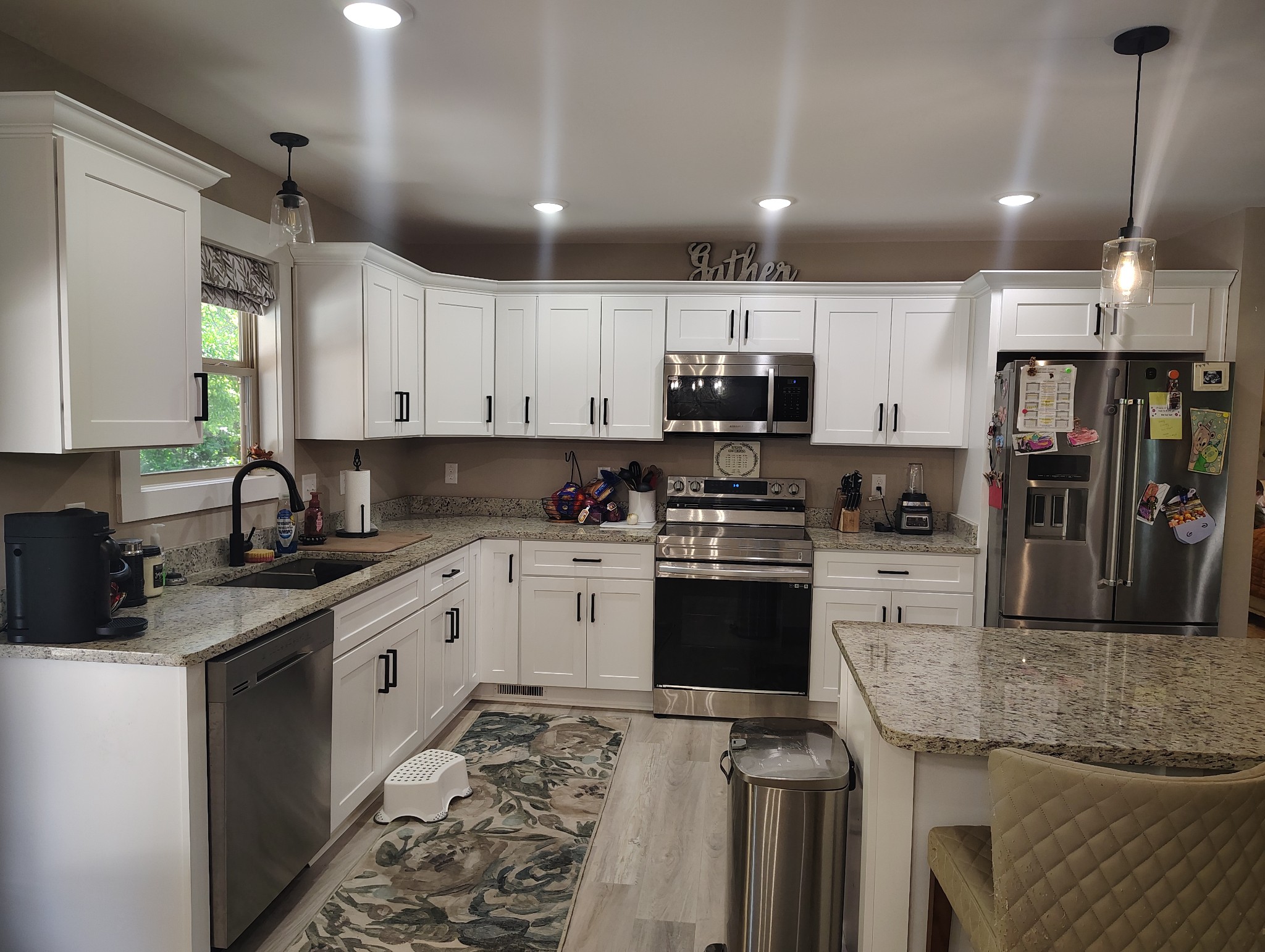 8447 Epperson Springs Road Westmoreland, TN 37186 - Photo 11 of 25 a kitchen with kitchen island granite countertop a sink stainless steel appliances and white cabinets