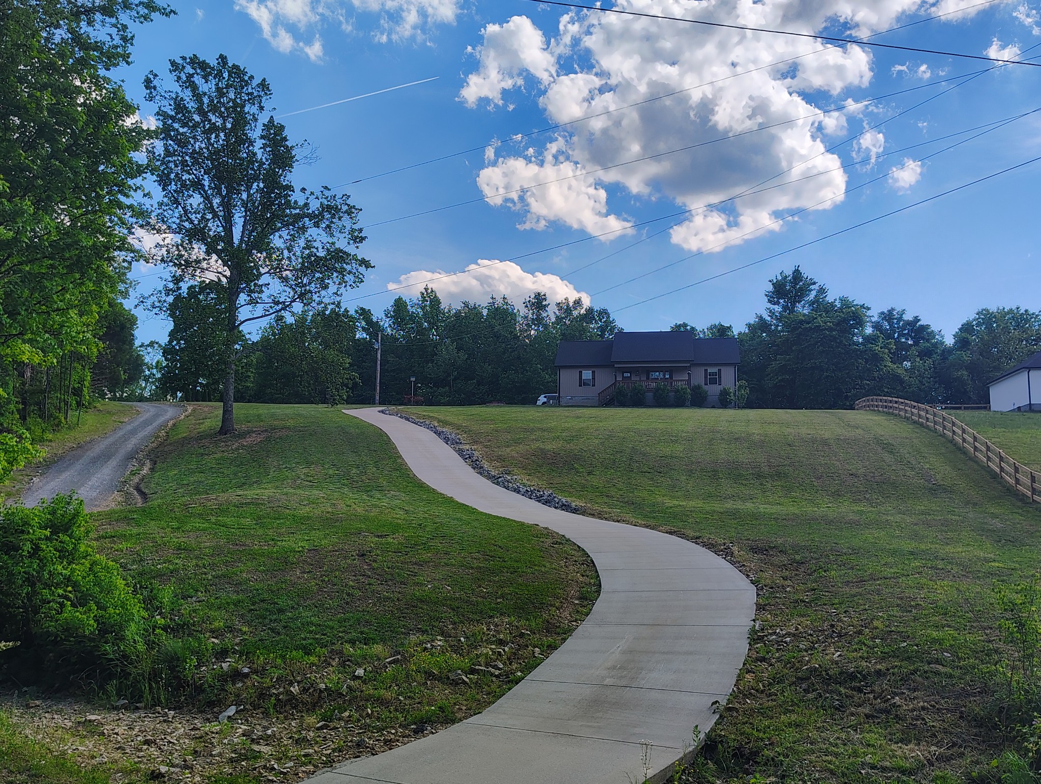 8447 Epperson Springs Road Westmoreland, TN 37186 - Photo 2 of 25 a view of a golf course with a lake