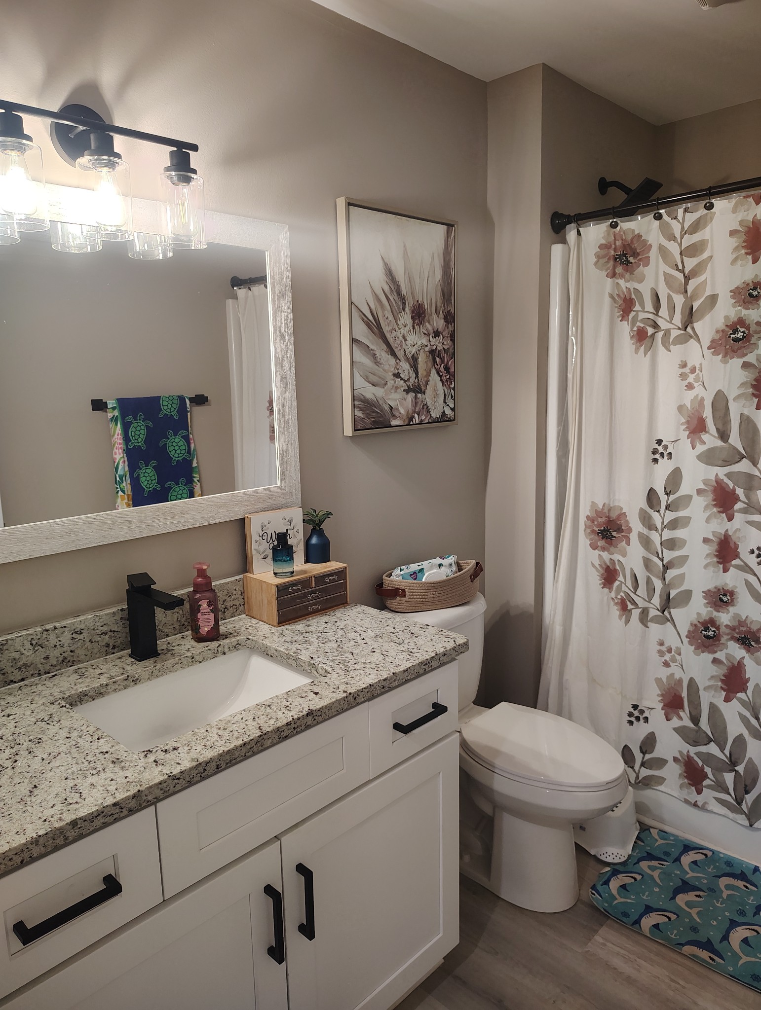 8447 Epperson Springs Road Westmoreland, TN 37186 - Photo 21 of 25 a bathroom with a granite countertop toilet a sink and a mirror