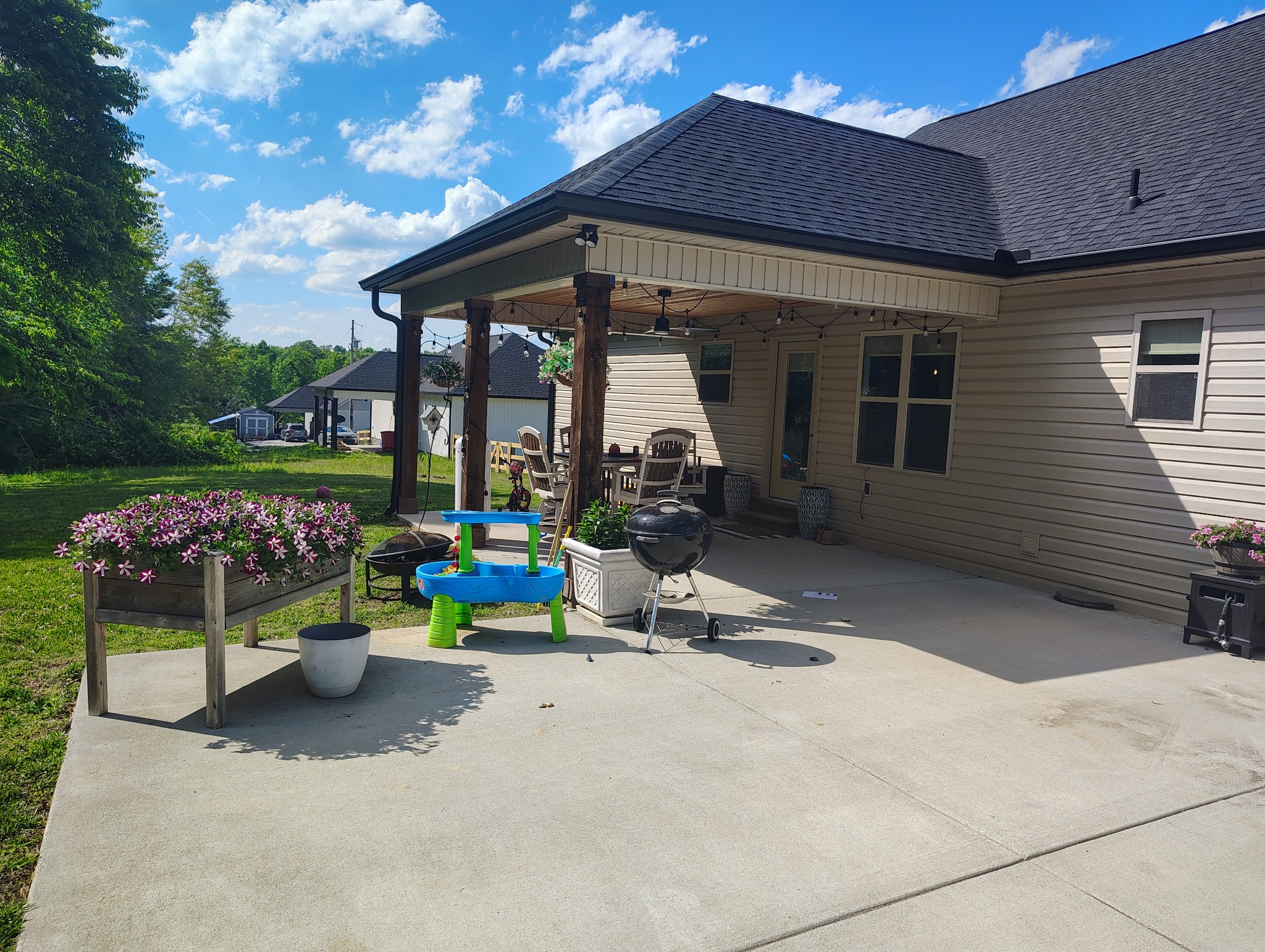 8447 Epperson Springs Road Westmoreland, TN 37186 - Photo 4 of 25 a view of a chair and table in backyard of the house