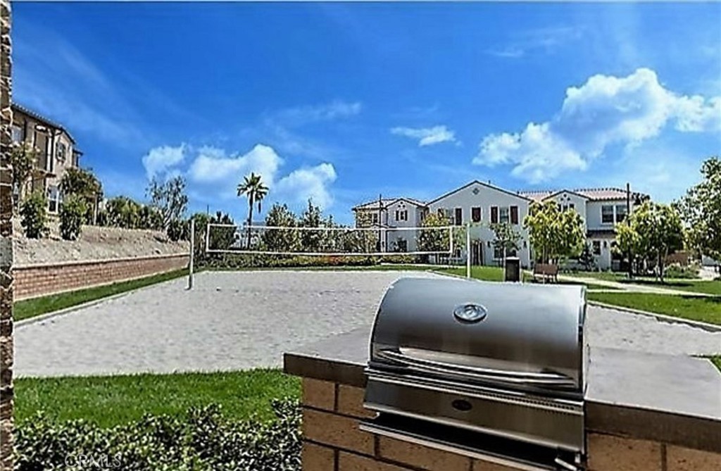67 Eclipse Lake Forest, CA 92630 - Photo 12 of 20 a view of a swimming pool with a patio and a yard