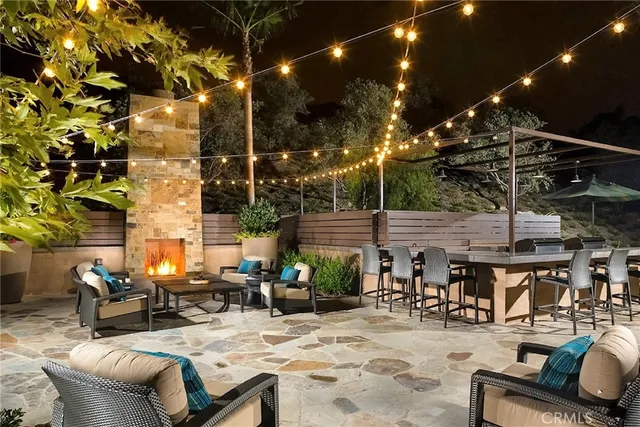 a view of a patio with a table and chairs