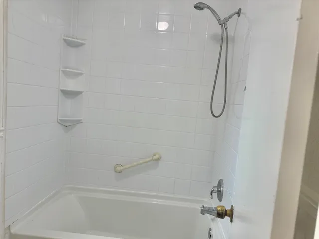 a close up view of a bathtub in bathroom