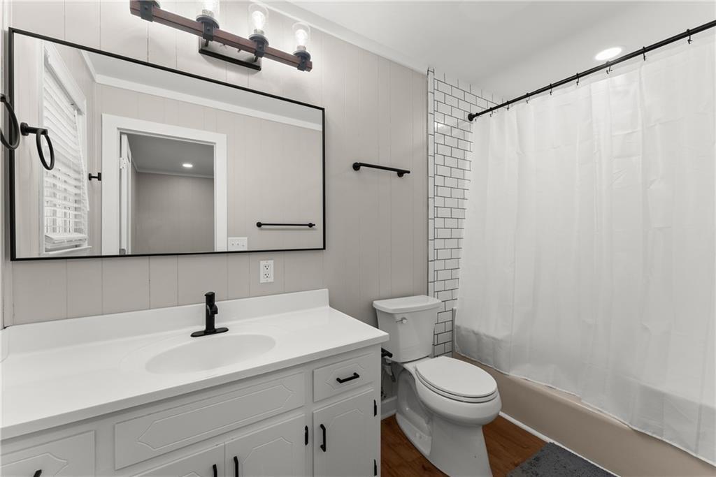 31 Pine Road Dahlonega, GA 30533 - Photo 17 of 32 a bathroom with a sink a toilet and a mirror