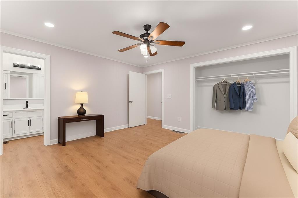 31 Pine Road Dahlonega, GA 30533 - Photo 18 of 32 a bedroom with a bed and a chandelier