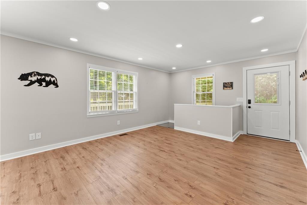 31 Pine Road Dahlonega, GA 30533 - Photo 20 of 32 a view of an empty room with wooden floor and a window